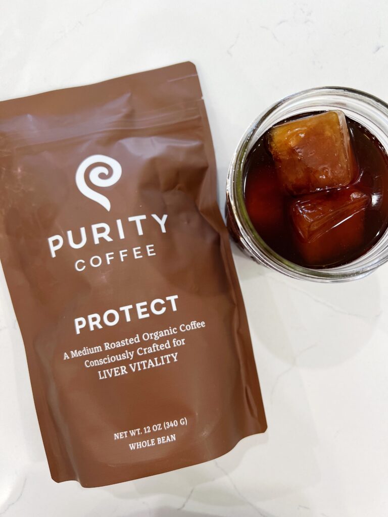 Iced Coffee in a glass wiht Purity Coffee Bag