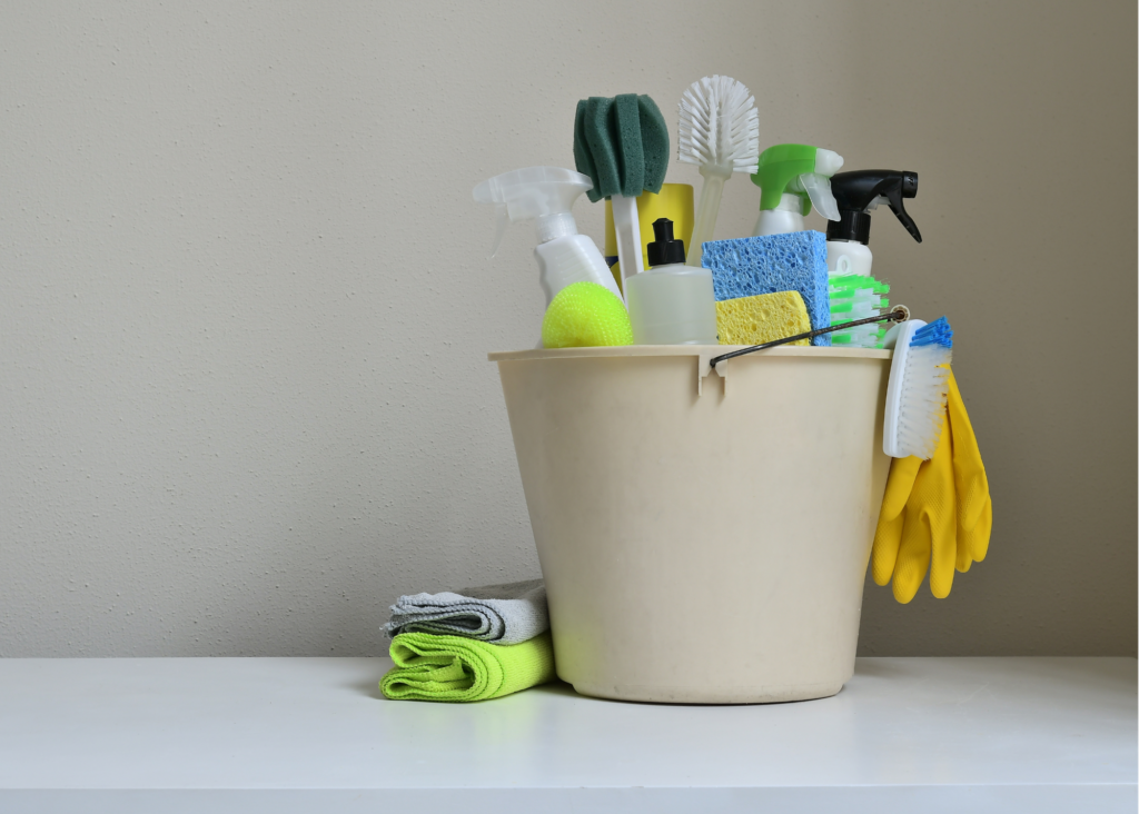 cleaning products and cleaning tools in a bucket