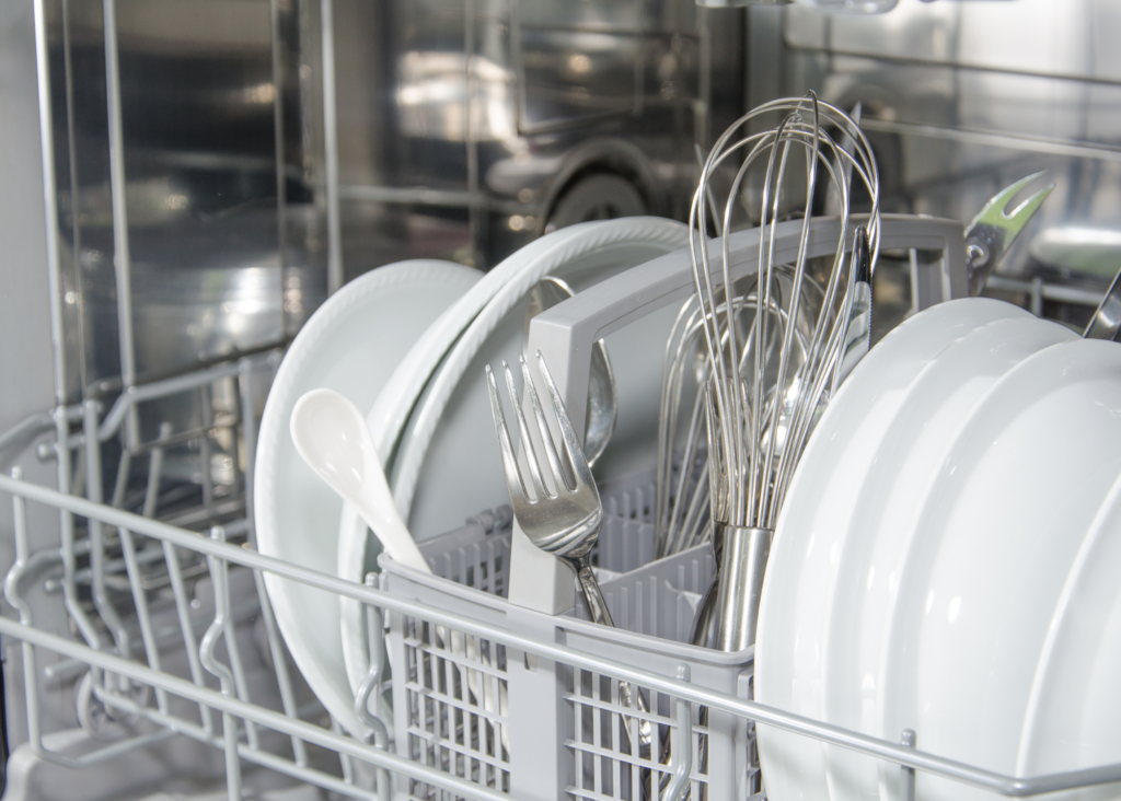 dishwasher filled with dishes and silverware